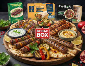 Plant-based kebab platter with grilled vegetables, dips, and iPlantBased vegan kebab box packaging