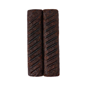 Two grilled plant-based kebab sausages with char marks on a white background from iPlantBased UAE.