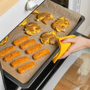 Baking tray with plant-based nuggets and roasted potatoes in oven, iPlantBased UAE