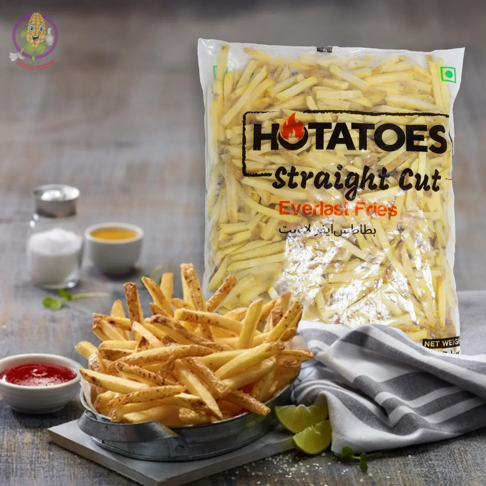 Hotatoes Straight Cut frozen fries in bag with served fries, ketchup, salt, and plant-based food setting.
